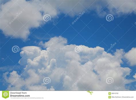 Thick Fluffy Cumulus Clouds In Sky Stock Photo Image Of Backlit
