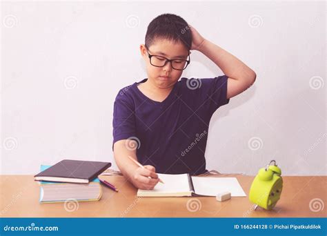 Bored And Tired Asian Student Boy Doing Homework Stock Photo Image Of