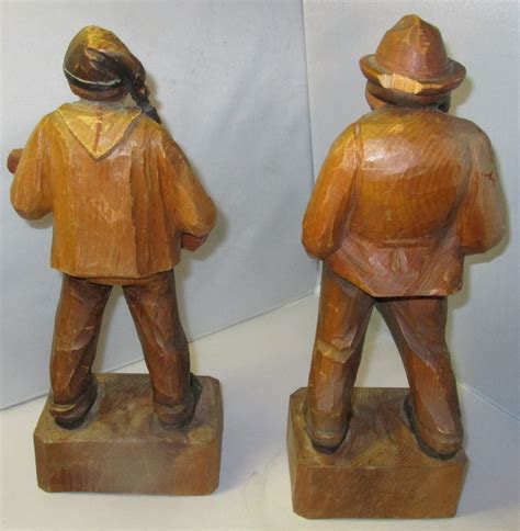 Two Carved Wood Men Figurines Antiques Board