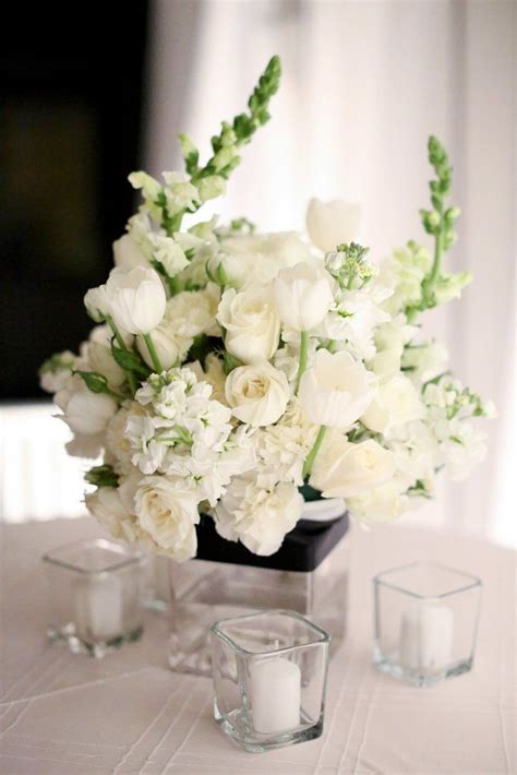 All White Centerpieces Of Tulips Roses Carnations And