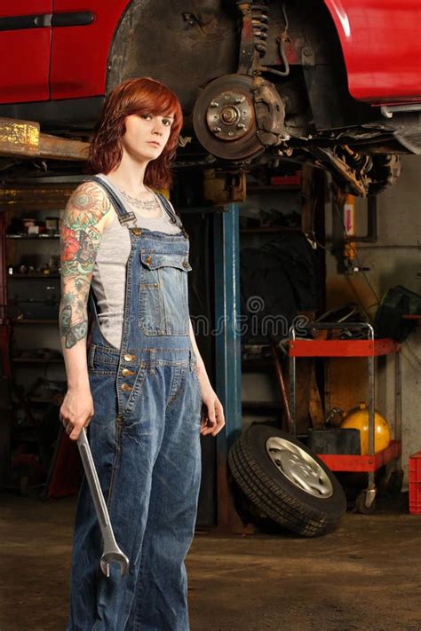 Female Mechanic With Tattoos Photo Of A Young Beautiful Redhead