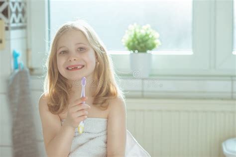 Portrait Of Pretty Little Child Girl With White Towel After Show Stock