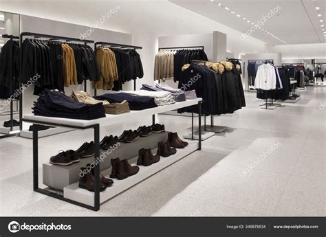 Modern Fashionable Brand Interior Of Men Clothing Shop Store Inside Shopping Center ⬇ Stock