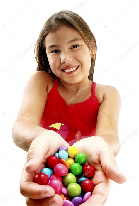 Young Girl Holding Candies Stock Photo By ©gosphotodesign 13773092