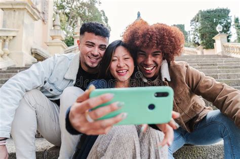 Group Of Teenage Multiracial Friends Having Fun Taking A Selfie Portrait With A Mobile Phone