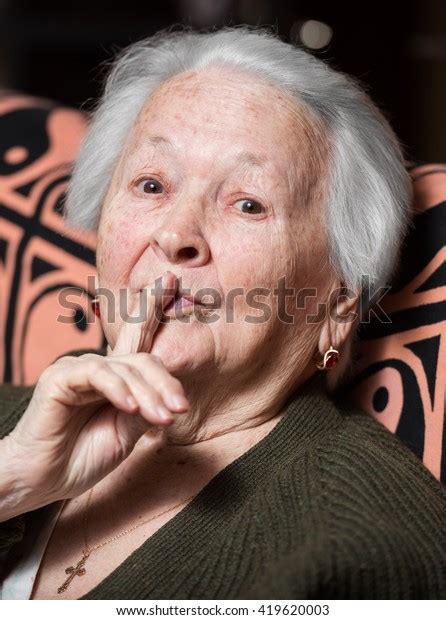 Old Woman Finger On Lips Asking Stock Photo 419620003 Shutterstock