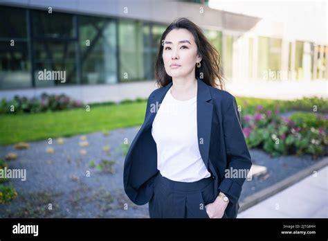 Asian confident business woman in suit. Bright future of career