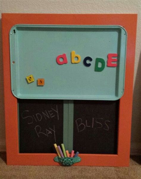 An Orange Frame With The Word Abcde Written On It And Some Crayons In