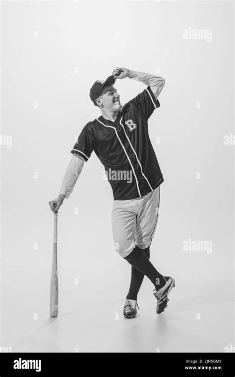 Full Length Portrait Of Young Smiling Man Baseball Player In Uniform