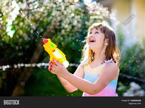 Kids Play Water Gun Image And Photo Free Trial Bigstock