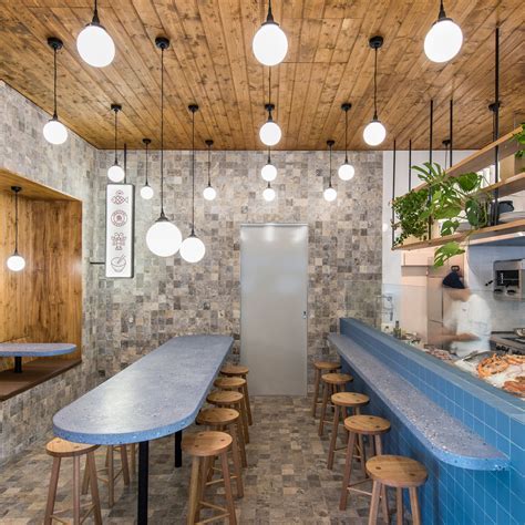 Sans Arc Studio Used Blue Terrazzo Grey Travertine And Stained Wood To