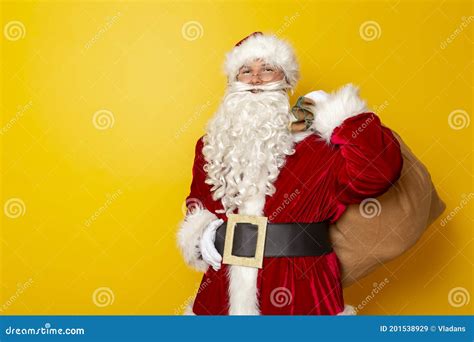 Santa Claus Holding A Sack Filled With Christmas Presents Stock Image