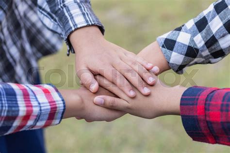 Young People Putting Their Hands Together Friends With Stack Of Hands