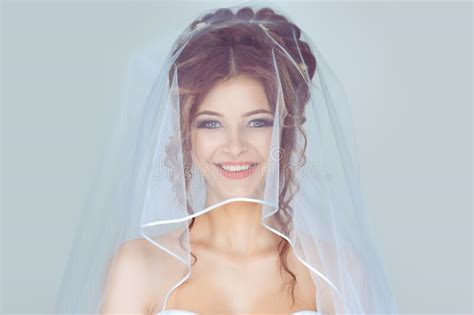 Beautiful Bride In Veil Closeup Shot Of Elegant Brunette Happy Bride Posing Under Veil Closeup