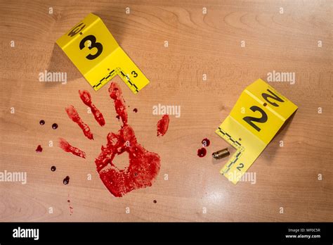 A Bloody Handprint Beside An Expended Shell Casing Both Marked With