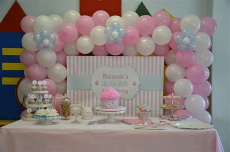 It's so easy and inexpensive to create this backdrop and it looks amazing! Cute as a Cupcake 1st Birthday Party Candy Buffet | Little ...