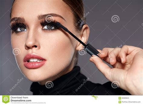 Beauty Beautiful Woman Applying Black Mascara On Eyelashes Stock Image