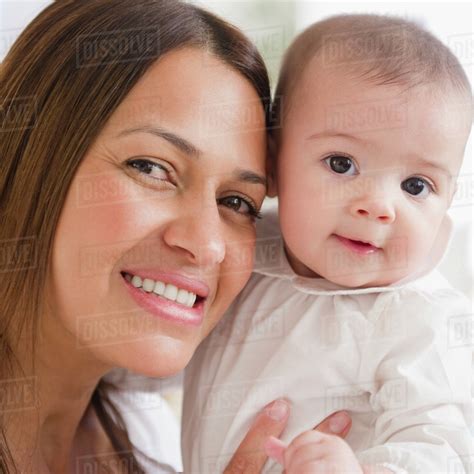 Smiling Mother Holding Baby Stock Photo Dissolve