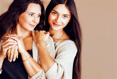 Cute Pretty Teen Daughter With Mature Mother Hugging Fashion Style Brunette Makeup Together