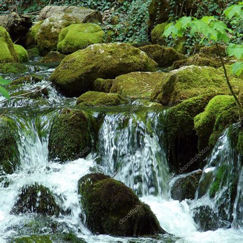 Waterfall On Mossy Rocks Stock Photo By ©rebekka 10833757