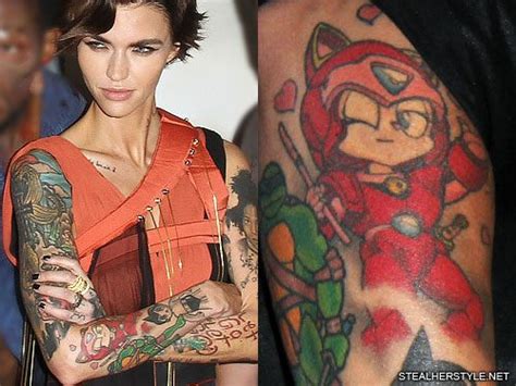 Portrait on her bicep dita parlow heart on her forearm; Ruby Rose's 48 Tattoos & Meanings | Steal Her Style