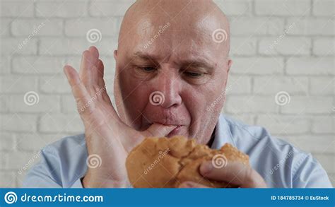 Hungry Person Eating A Tasty Hamburger Enjoy Delicious Fast Food Stock