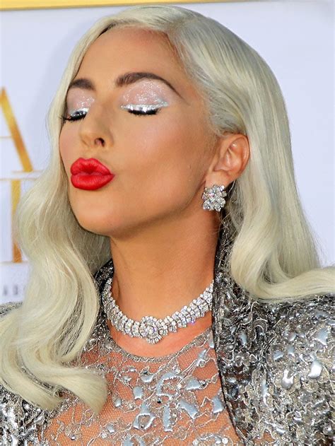 Lady gaga 's soaking up the sun in a trendy (and cheeky!) swimsuit. Lady Gaga Brings Back Crazy Platforms in Dramatic Givenchy Gown