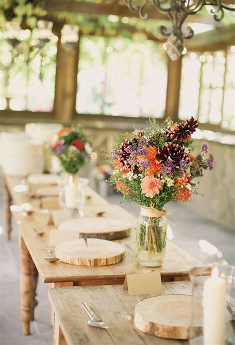 Harvest Table Settings And Colorful Wildflower Centerpieces Photo By