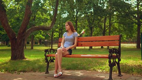 Girl Sitting On A Bench Waiting For Someone Free Stock Video