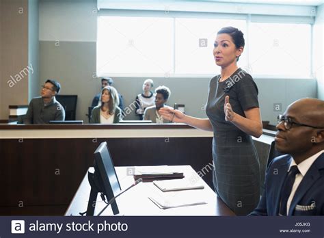 Female Prosecutor Attorney Talking In Legal Trial Courtroom Stock Photo