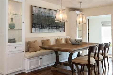 A Built In Banquette Is Flanked By Tall Glass Cabinets For Storing