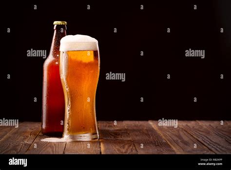 Photo Of Buttle And Glass Of Beer Stock Photo Alamy
