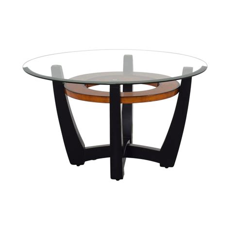 These elegant tables easily nest together to save space and the smaller table can be pulled out when needed. 84% OFF - Macy's Elation Round Glass & Wood Coffee Table ...