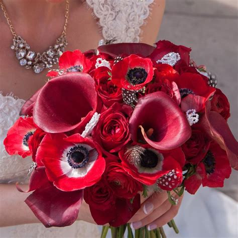 Unique Bridal Bouquet Filled With Style Red Calla Lilies Anemone Red Roses And Red Ra