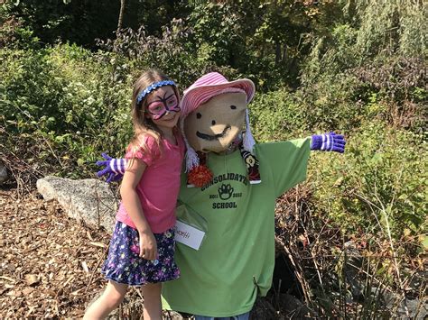 Baby Grace Grace Poses With Her Class Scarecrow On New