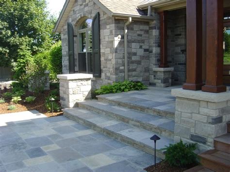 An ordinary home can become the house with the red door with nothing more than a simple coat of paint, while a magnificent piece of architecture can rely on a unique door style to tie its exterior design together. Entryways, Steps and Courtyard - Puslinch, ON - Photo ...
