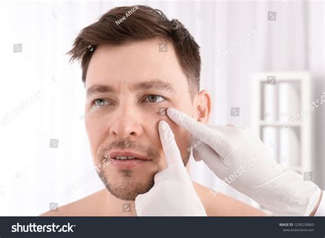 Doctor Examining Patient Clinic Visiting Dermatologist Stock Photo