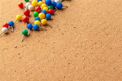 Premium Photo Group Of Colorful Push Pins On Cork Bulletin Board