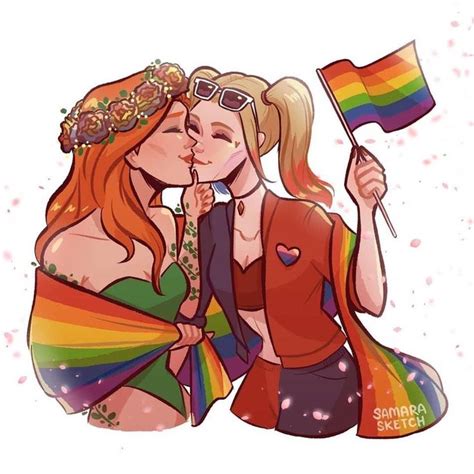 Two Beautiful Women Kissing Each Other With A Rainbow Flag