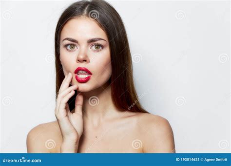 Attractive Woman Holds Hand Near Face Open Mouth Bare Shoulders Spa