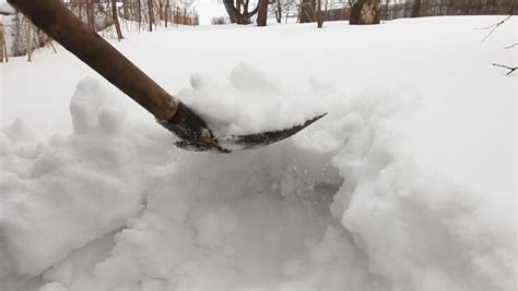 Man Clearing Deep Snow Off Shovel Stock Footage Video 100 Royalty