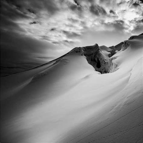 Dramatic Snow Covered Mountain Landscape And Crevasse Print By Matthew