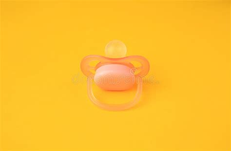 One New Baby Pacifier On Orange Background Stock Photo Image Of
