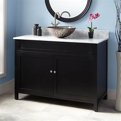 And though this bathroom appears small, the right assortment of compartments on the vanity and the placement of the sink shows that there is enough space for essentials and more. 48" Darin Vessel Sink Vanity - Black