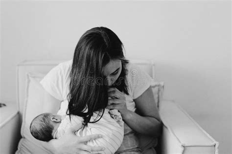 Newborn Baby Boy Sucking Milk From Mothers Breast Portrait Of Mom And