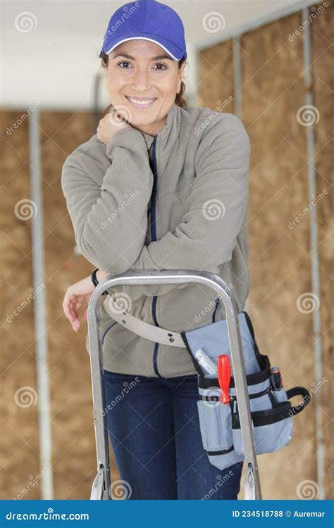 Young Woman Builder Stands On Stepladder Stock Photo Image Of