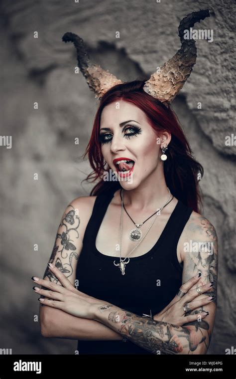 Woman With Red Hair Huge Devil Horns Decorates Her Head Portrait Of