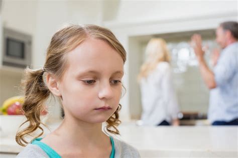 Premium Photo Sad Girl Listening To Her Parents Arguing