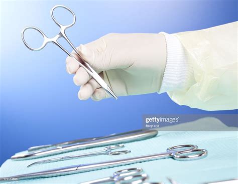 Medical Personnel With Surgery Instruments High Res Stock Photo Getty