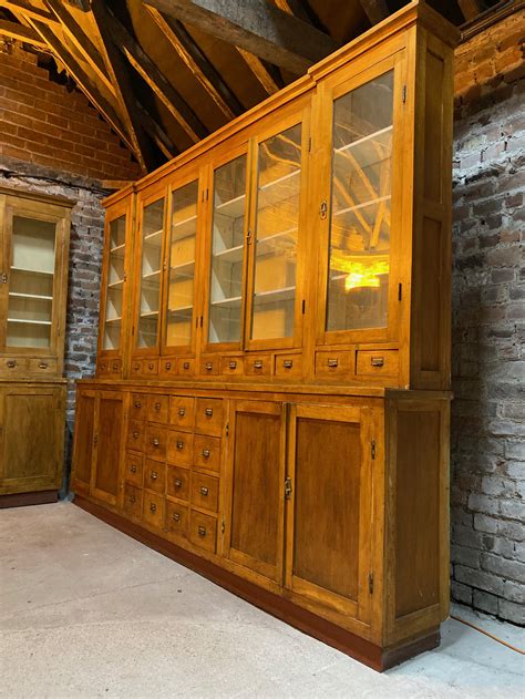 An upright, cupboardlike repository with shelves, drawers, or compartments. Large Apothecary Display Cabinet Pharmacy Circa 1920s ...